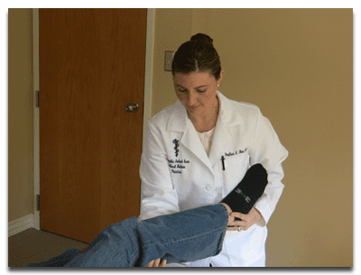 Dr. Olex treating a patient